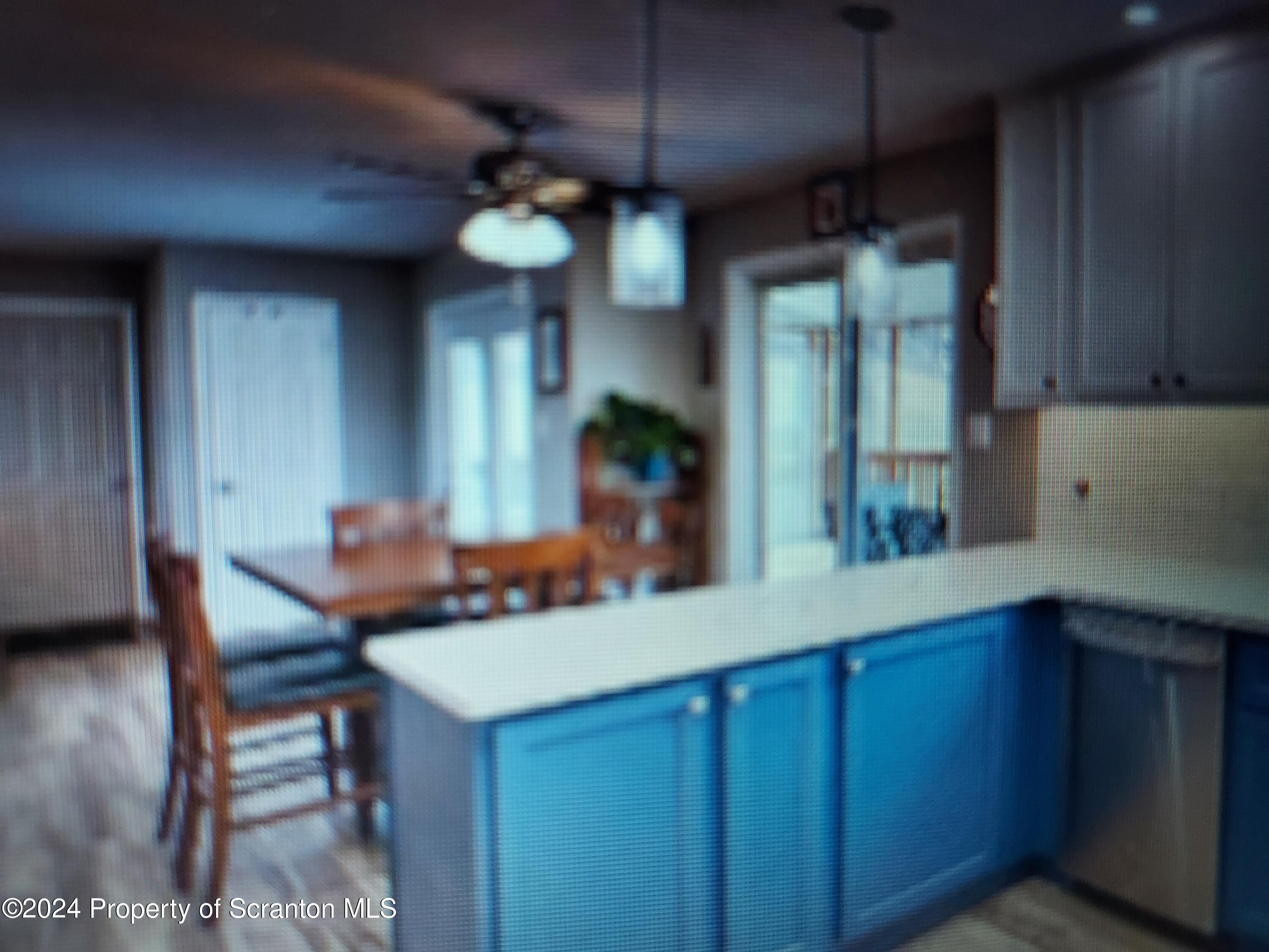 620 Layton Road Clarks Summit, PA 18411 - Photo 4 of 7 a kitchen with a table and chairs in it