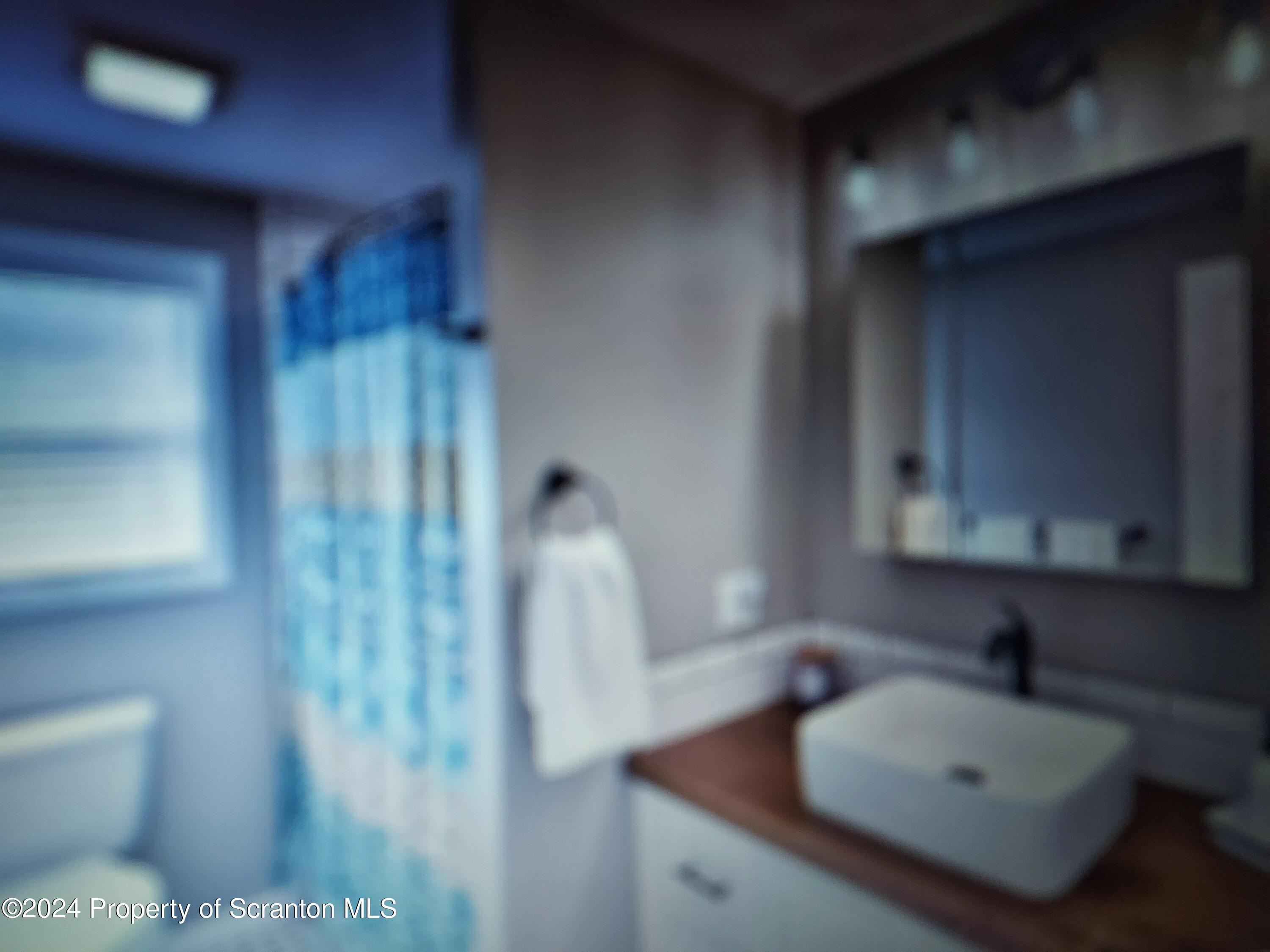 620 Layton Road Clarks Summit, PA 18411 - Photo 6 of 7 a bathroom with a sink toilet and shower