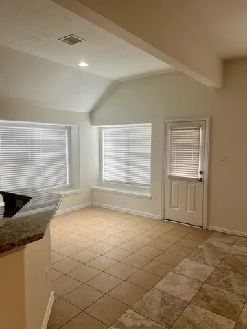 a view of an empty room and window