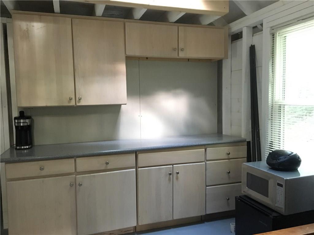 213 Ladd Road Oakland, ME 04963 - Photo 11 of 16 Maple cabinets and Corian countertops.