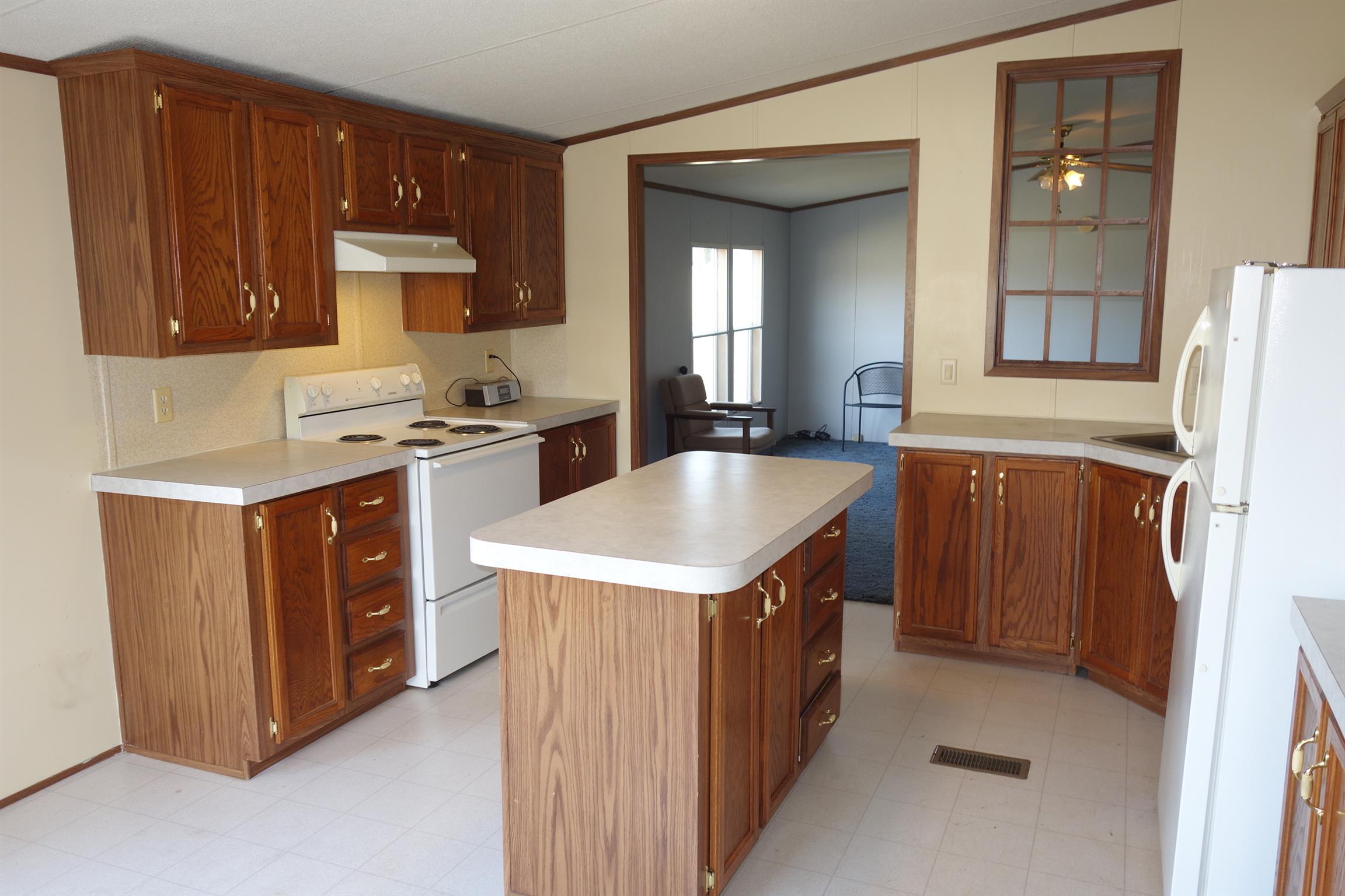 114 East Biggs Road Portland, TN 37148 - Photo 15 of 26 a kitchen with a stove sink and cabinets