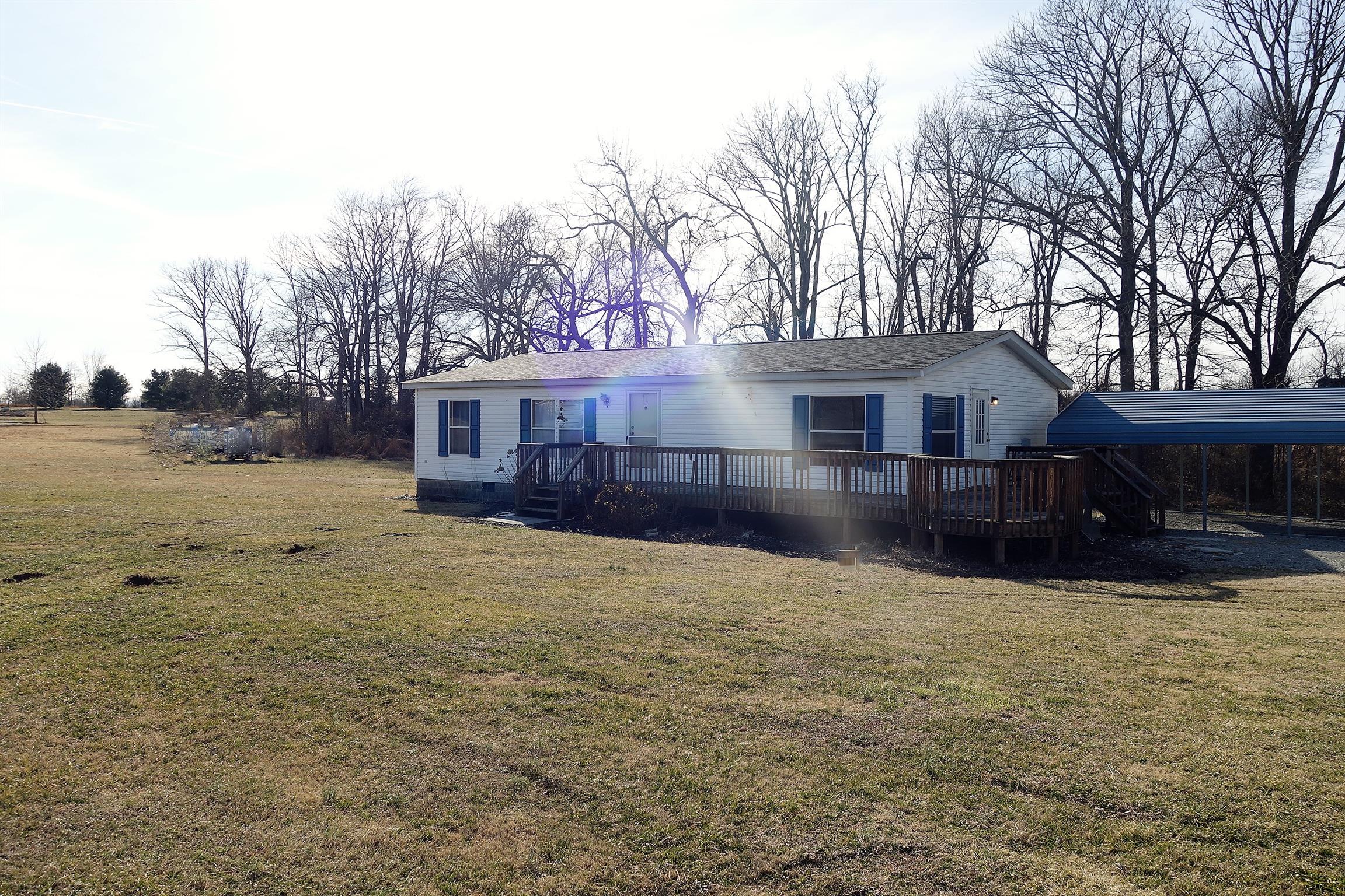 114 East Biggs Road Portland, TN 37148 - Photo 8 of 26 a view of a house with a yard covered with snow in front of house