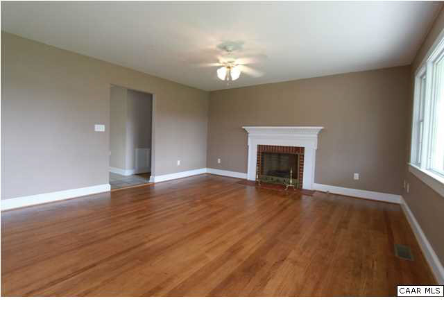 91 Childs Road Stanardsville, VA 22973 - Photo 2 of 17 Large living room with natural gas fireplace.