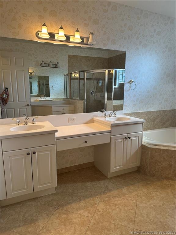 270 Southwest Walking Path Stuart, FL 34997 - Photo 12 of 25 a bathroom with a sink and a bathtub