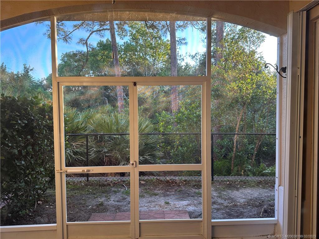 270 Southwest Walking Path Stuart, FL 34997 - Photo 19 of 25 a view of a room with a large window and wooden floor