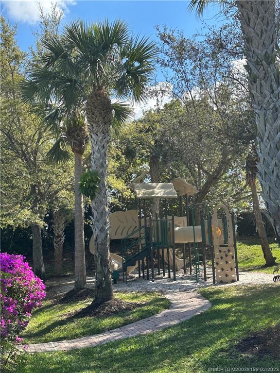 270 Southwest Walking Path Stuart, FL 34997 - Photo 22 of 25 a view of a house with a yard and tree s