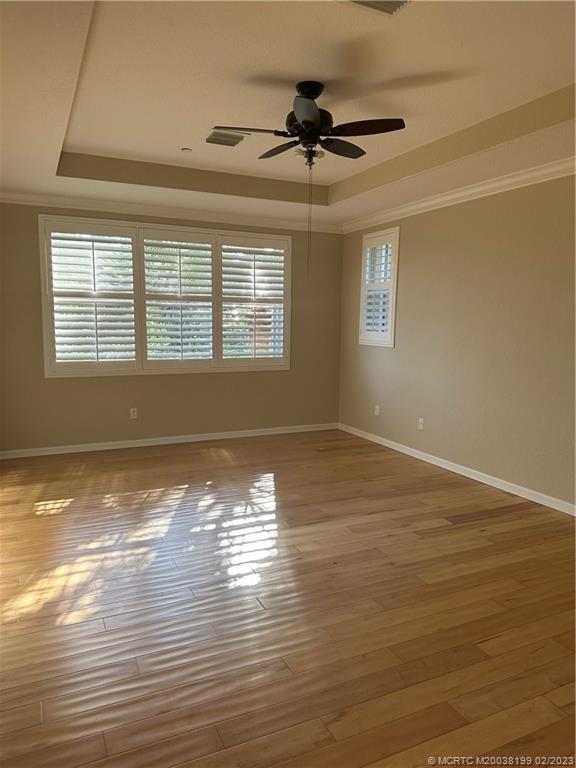 270 Southwest Walking Path Stuart, FL 34997 - Photo 10 of 25 a view of an empty room with wooden floor and a window