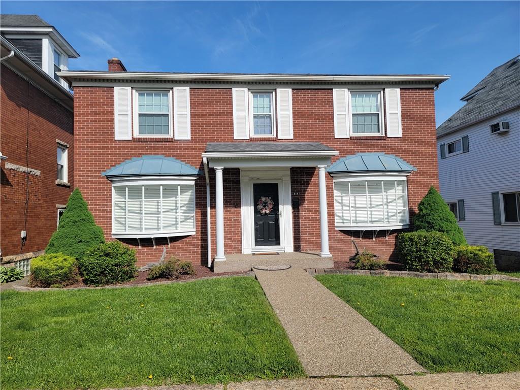 414 Hancock Avenue Vandergrift, PA 15690 - Photo 1 of 16 front view of a house with a yard