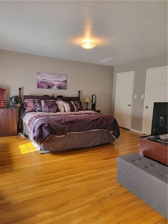 414 Hancock Avenue Vandergrift, PA 15690 - Photo 12 of 16 a bedroom with a bed and a flat screen tv