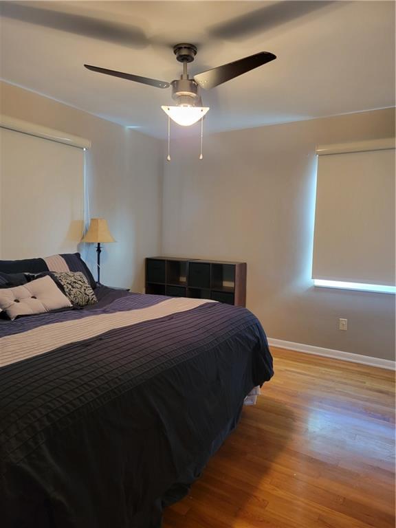 414 Hancock Avenue Vandergrift, PA 15690 - Photo 15 of 16 a bedroom with a bed and wooden floor