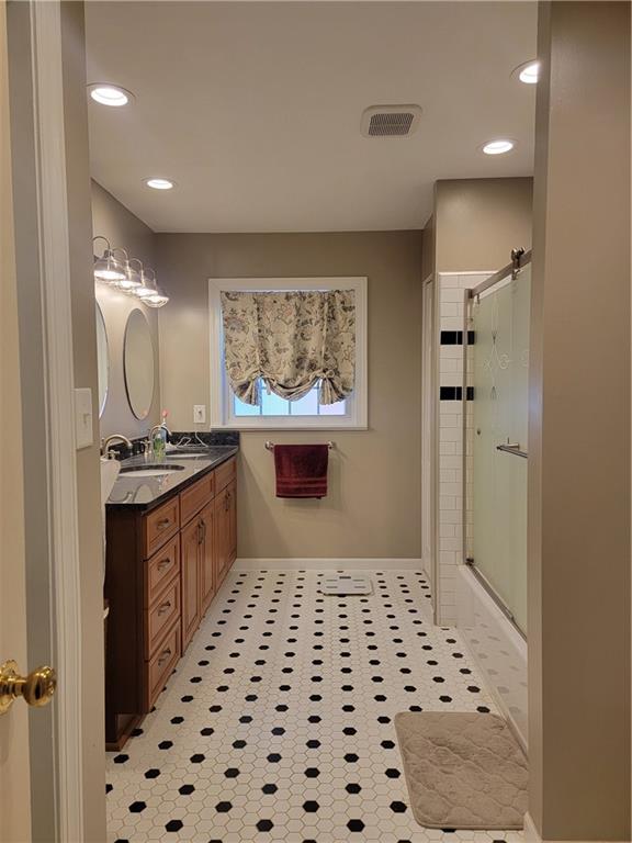 414 Hancock Avenue Vandergrift, PA 15690 - Photo 16 of 16 a large bathroom with a sink a mirror and a shower