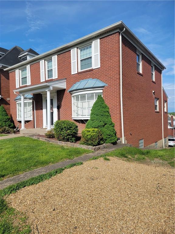 414 Hancock Avenue Vandergrift, PA 15690 - Photo 2 of 16 front view of house with a yard