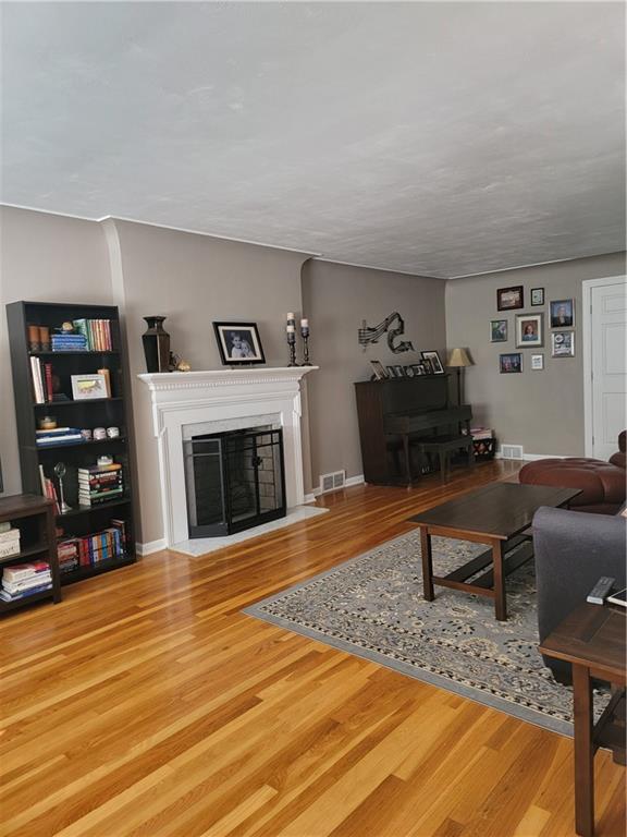 414 Hancock Avenue Vandergrift, PA 15690 - Photo 4 of 16 a living room with furniture and a fireplace