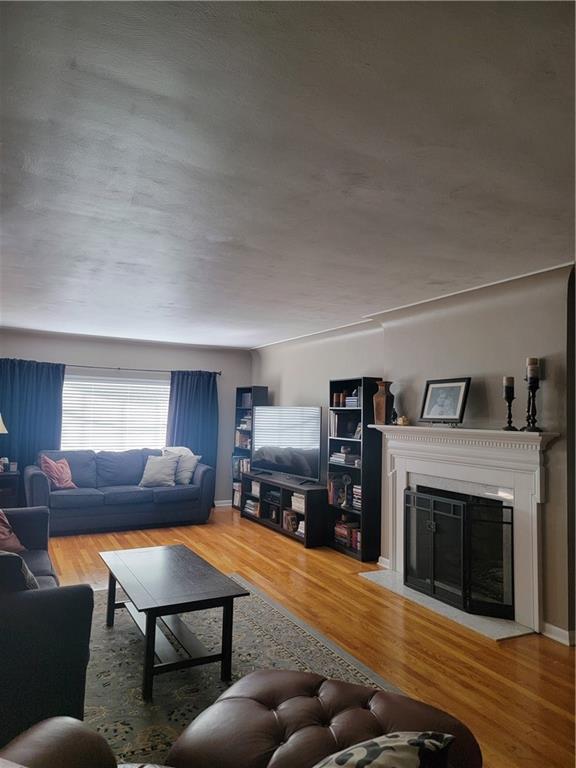 414 Hancock Avenue Vandergrift, PA 15690 - Photo 5 of 16 a living room with furniture and a fireplace