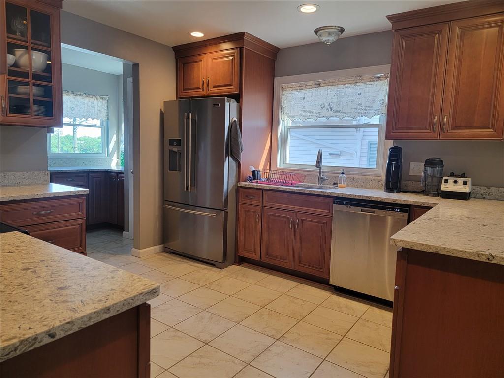 414 Hancock Avenue Vandergrift, PA 15690 - Photo 6 of 16 a kitchen with stainless steel appliances granite countertop a sink stove and refrigerator