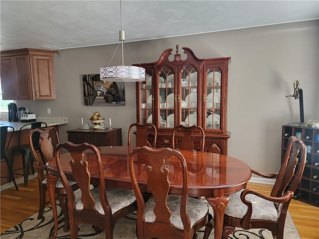 414 Hancock Avenue Vandergrift, PA 15690 - Photo 9 of 16 a view of a dining room with furniture and wooden floor