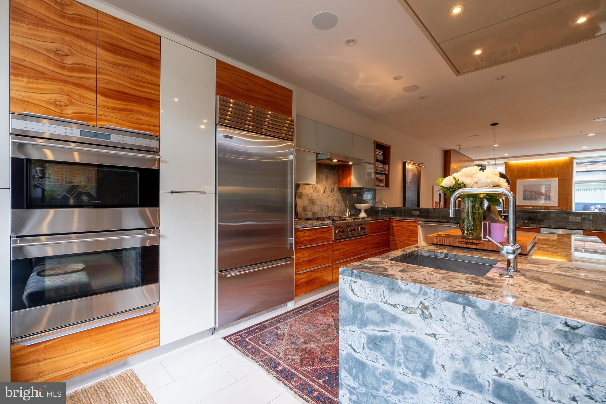 136 North 22nd Street Philadelphia, PA 19103 - Photo 17 of 78 a kitchen with stainless steel appliances granite countertop a refrigerator and a sink