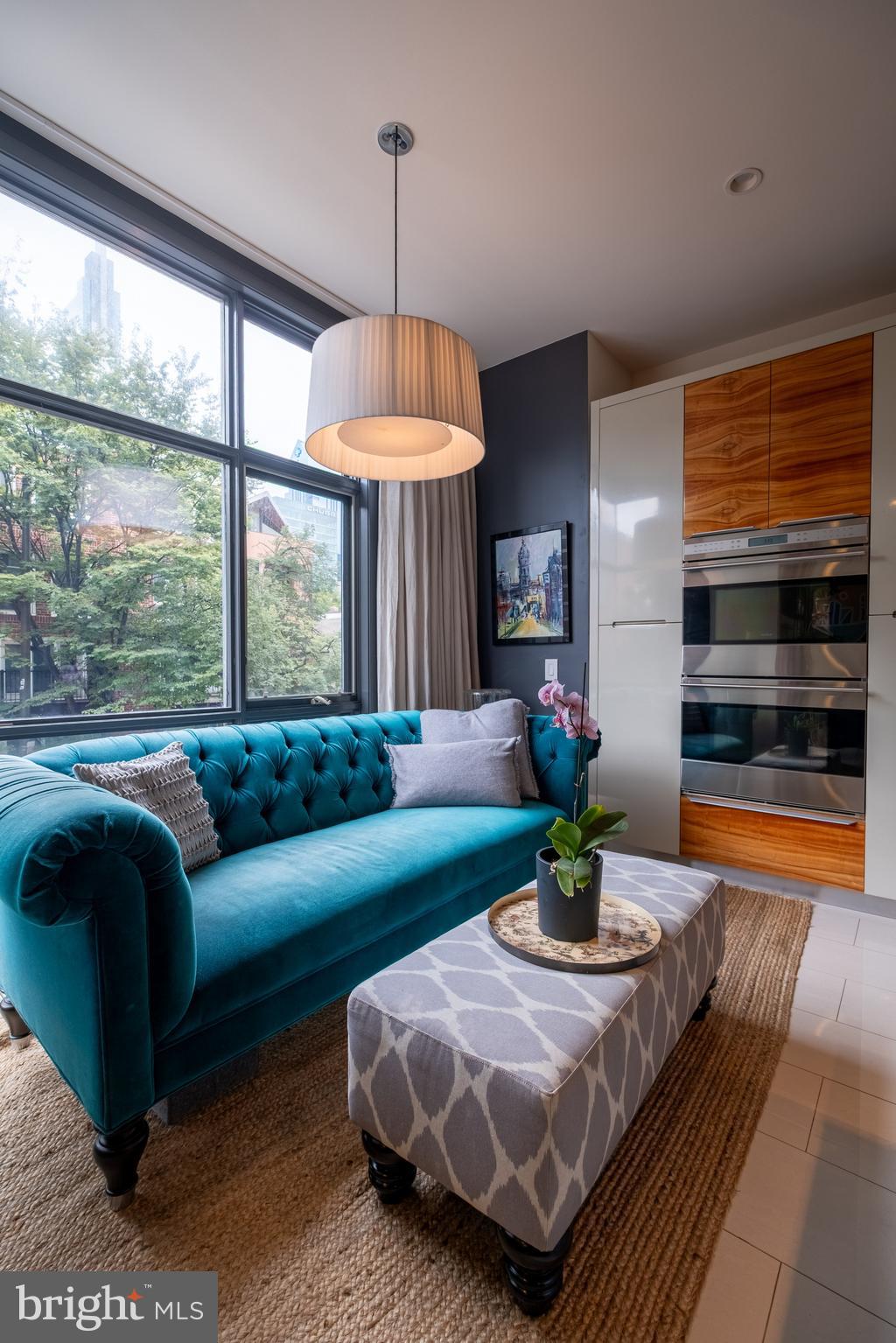 136 North 22nd Street Philadelphia, PA 19103 - Photo 22 of 78 a living room with furniture and a large window
