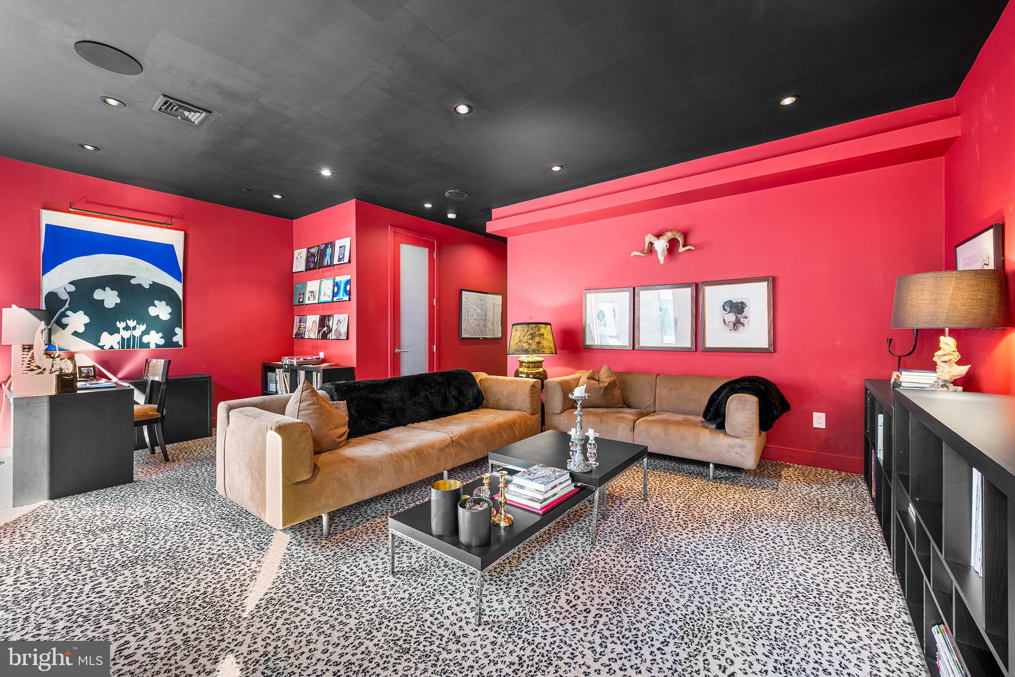 136 North 22nd Street Philadelphia, PA 19103 - Photo 34 of 78 a living room with furniture a flat screen tv and a fireplace