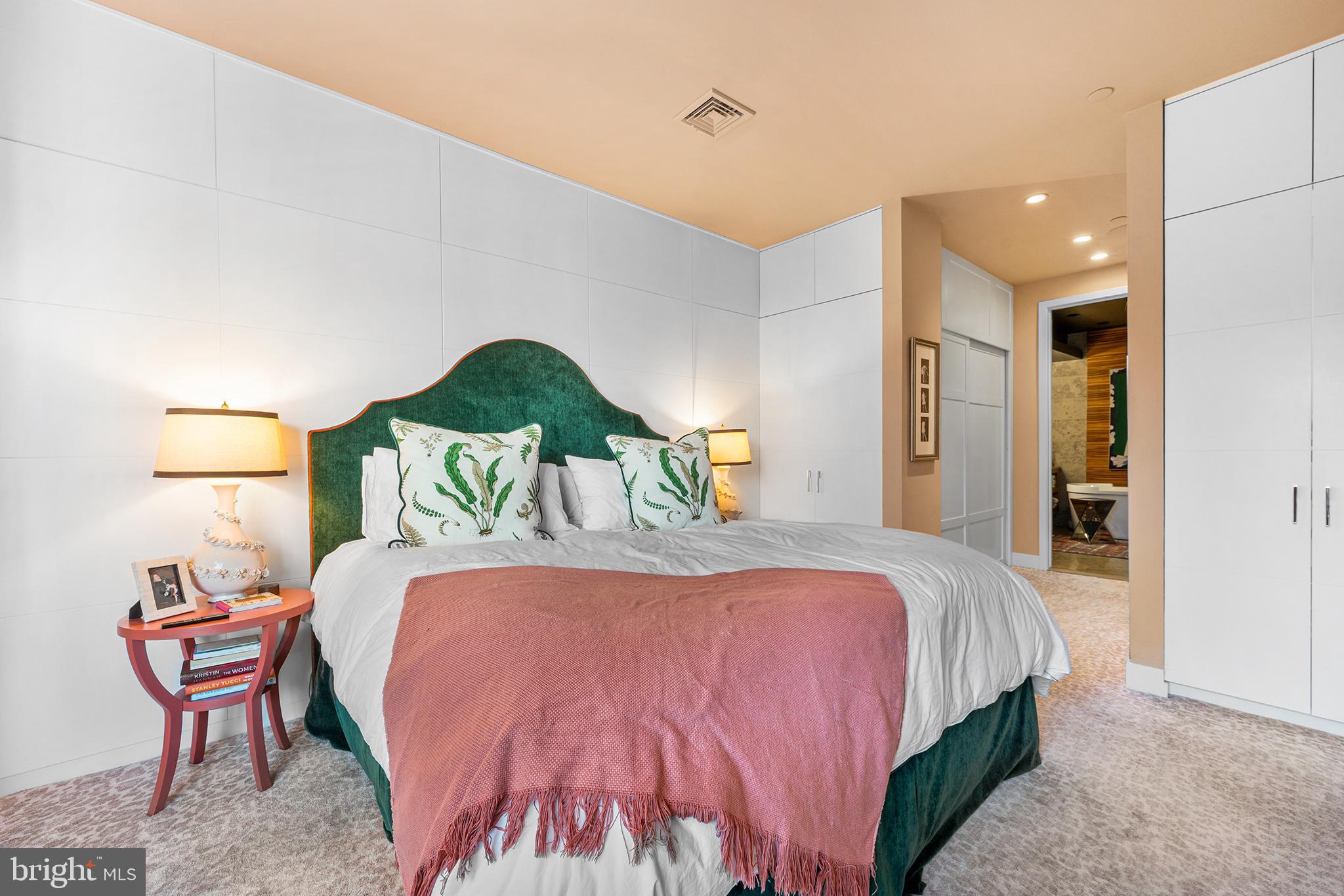 136 North 22nd Street Philadelphia, PA 19103 - Photo 38 of 78 a bedroom with a bed and a painting on the wall