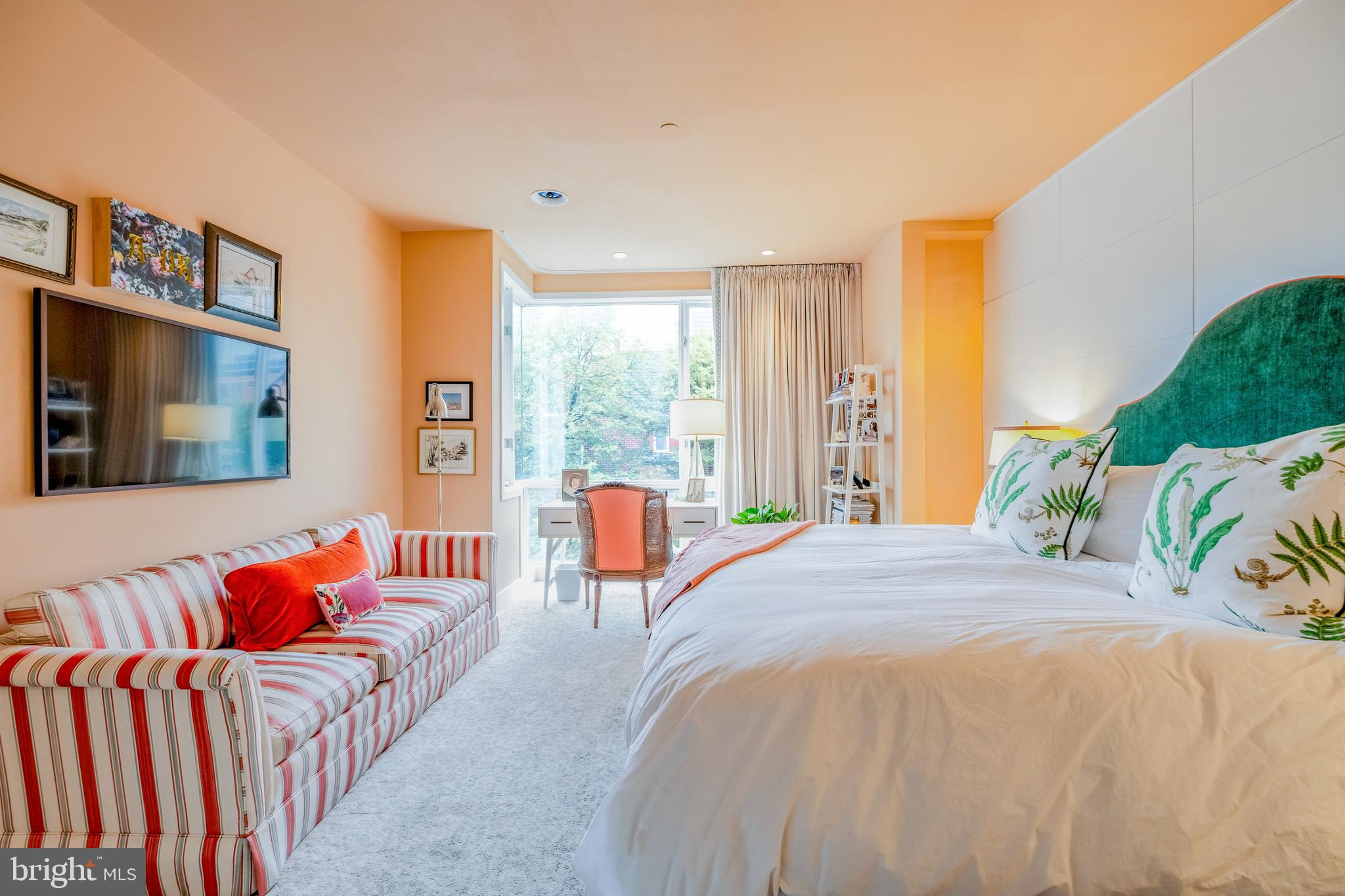 136 North 22nd Street Philadelphia, PA 19103 - Photo 39 of 78 a bedroom with a bed and a large window