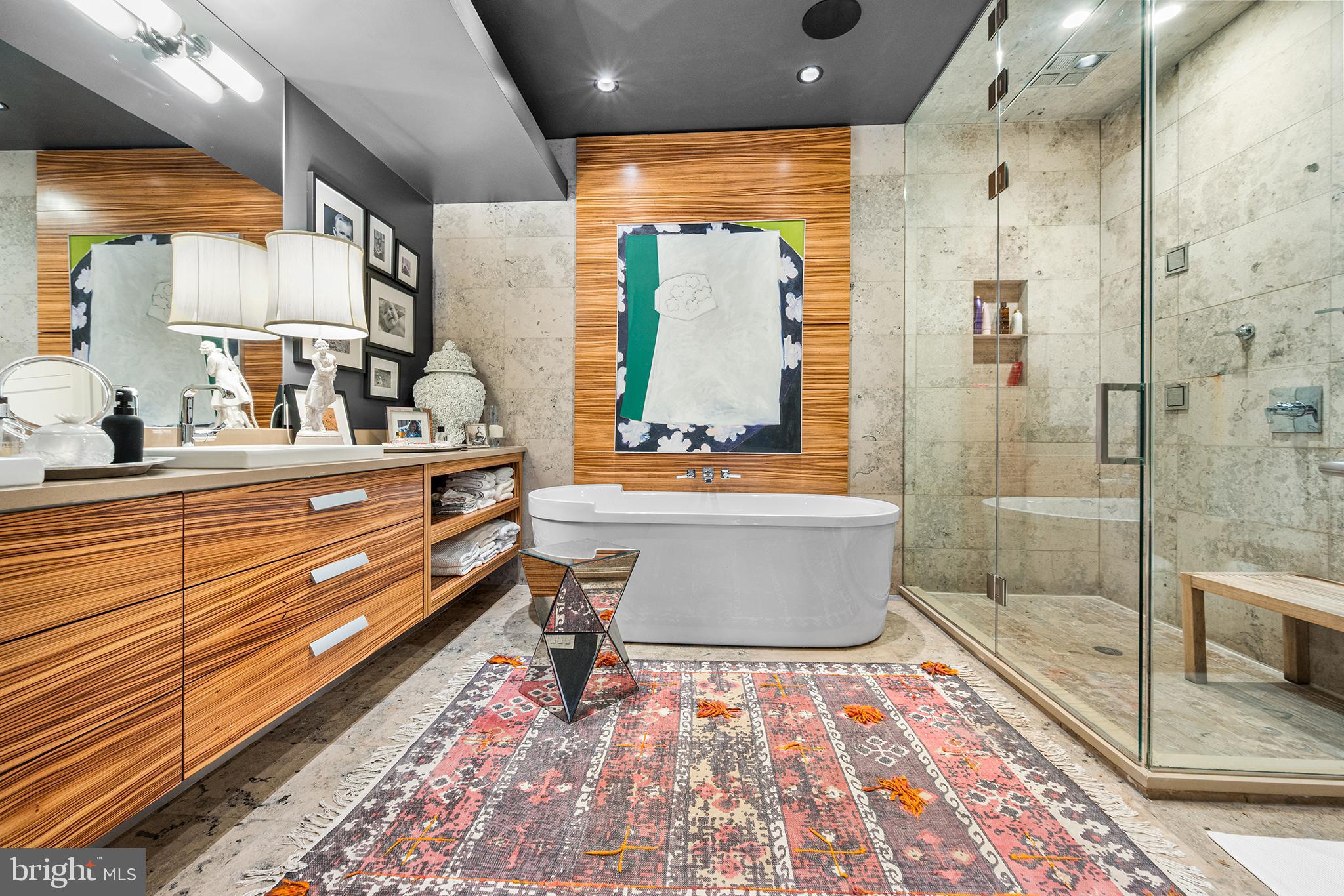 136 North 22nd Street Philadelphia, PA 19103 - Photo 41 of 78 a bathroom with a bathtub and a shower