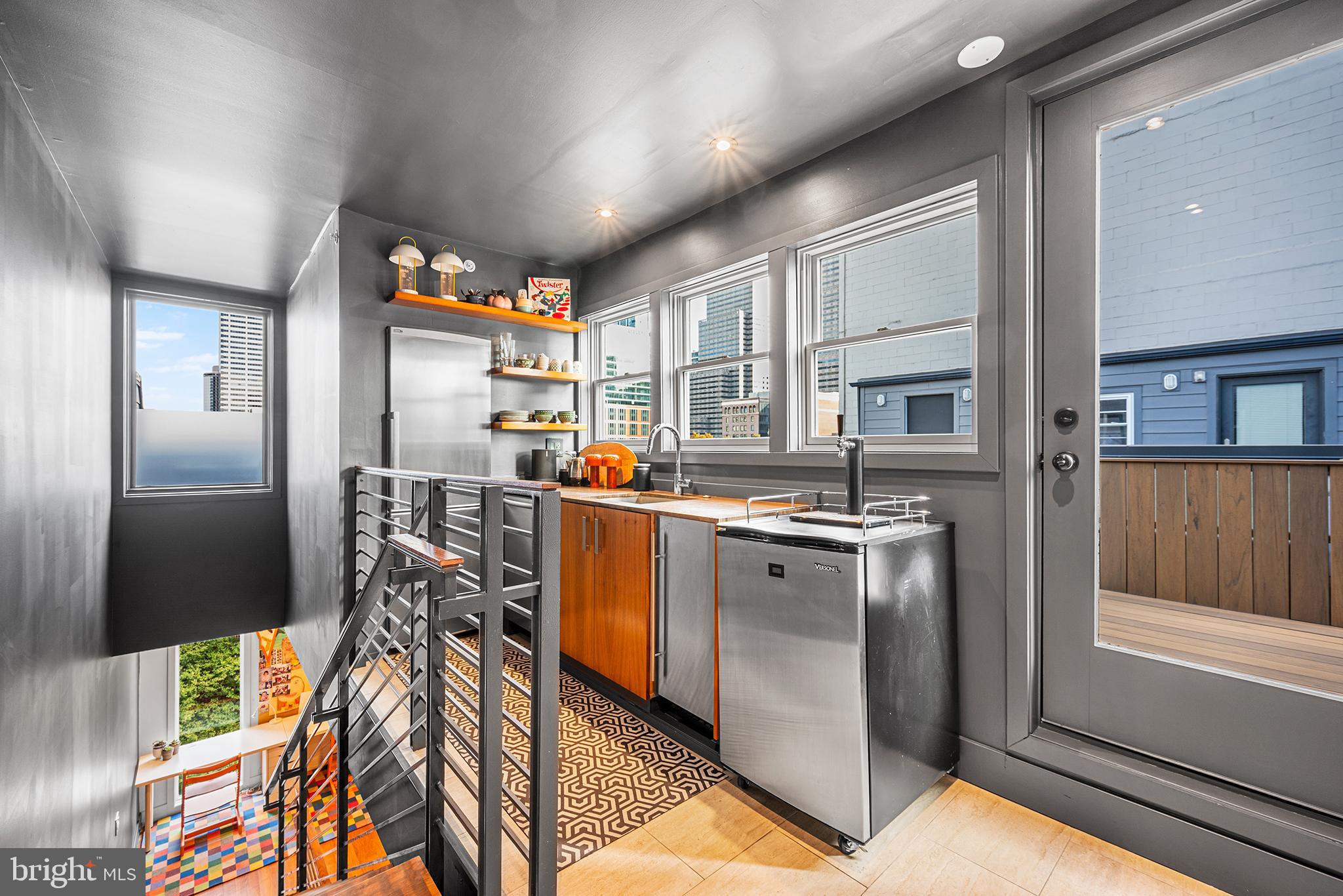 136 North 22nd Street Philadelphia, PA 19103 - Photo 56 of 78 a kitchen with stainless steel appliances granite countertop a refrigerator and a sink