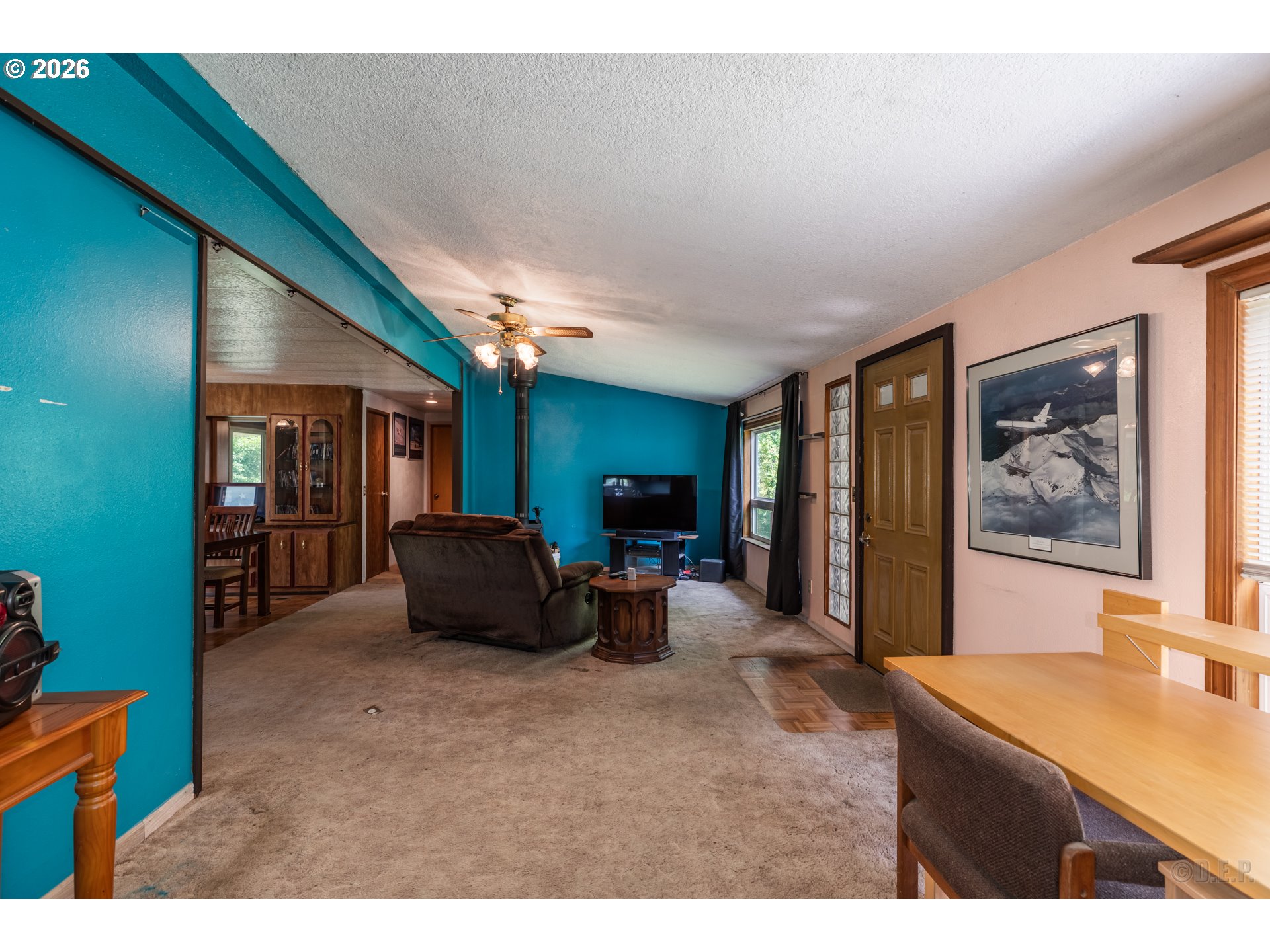 66971 Maplecrest Road Deer Island, OR 97054 - Photo 8 of 24 a living room with furniture and a flat screen tv