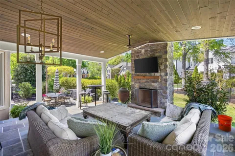 a outdoor space with patio furniture and a fireplace