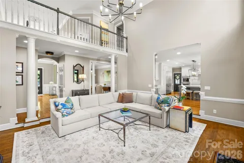 a living room with furniture and a rug