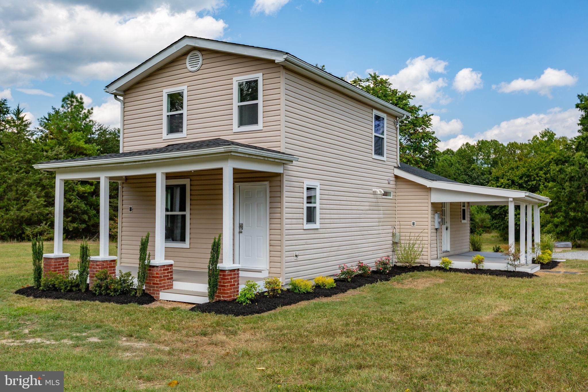 9113 Thornton Rolling Road Fredericksburg, VA 22408 - Photo 1 of 31 a front view of house with yard and green space