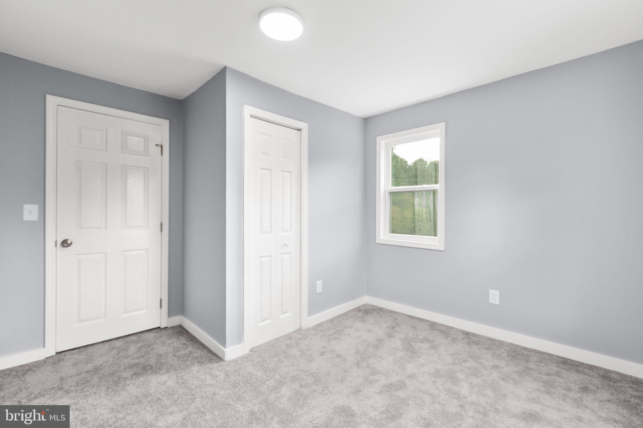 9113 Thornton Rolling Road Fredericksburg, VA 22408 - Photo 21 of 31 an empty room with windows