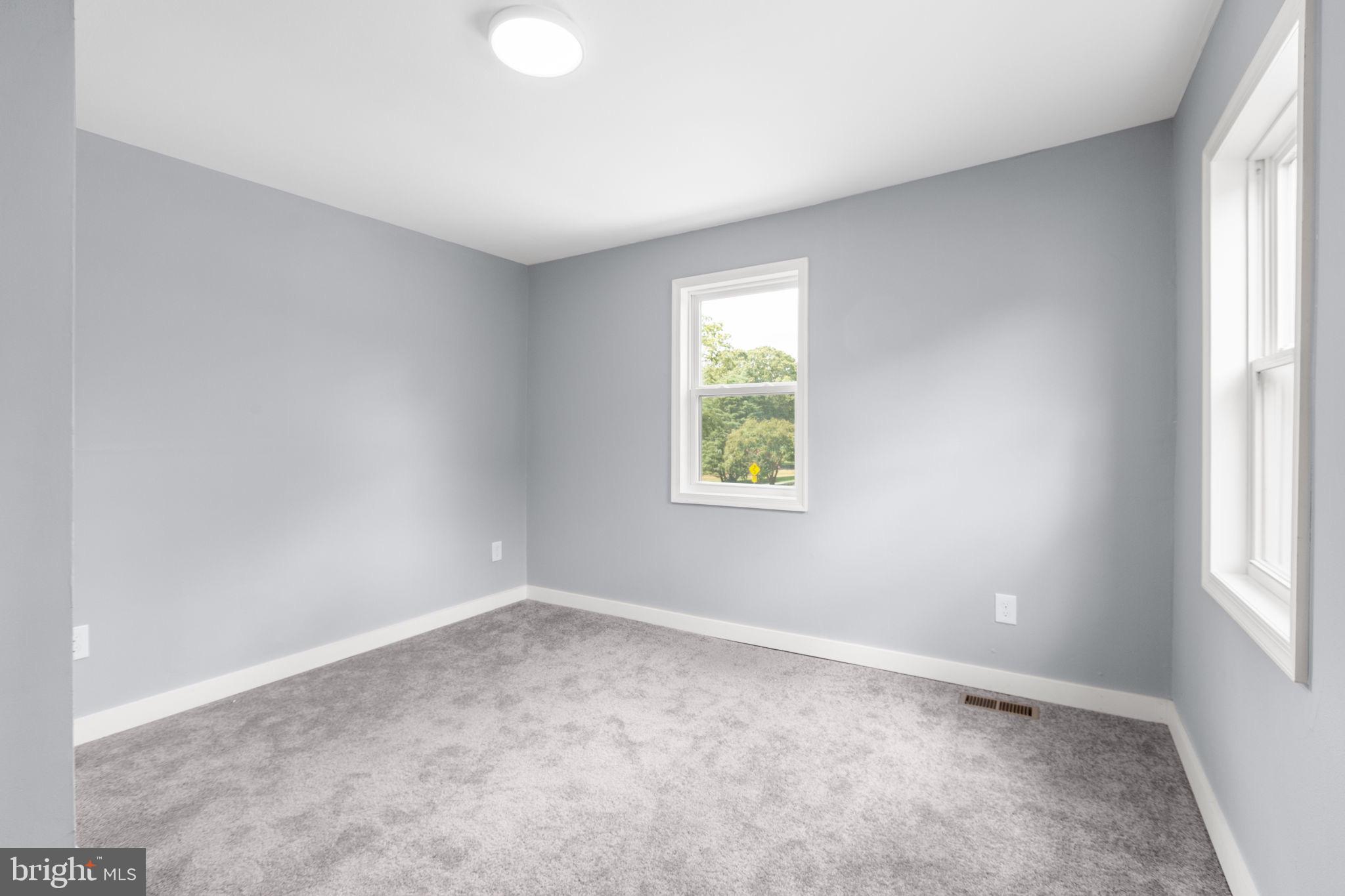 9113 Thornton Rolling Road Fredericksburg, VA 22408 - Photo 22 of 31 an empty room with windows