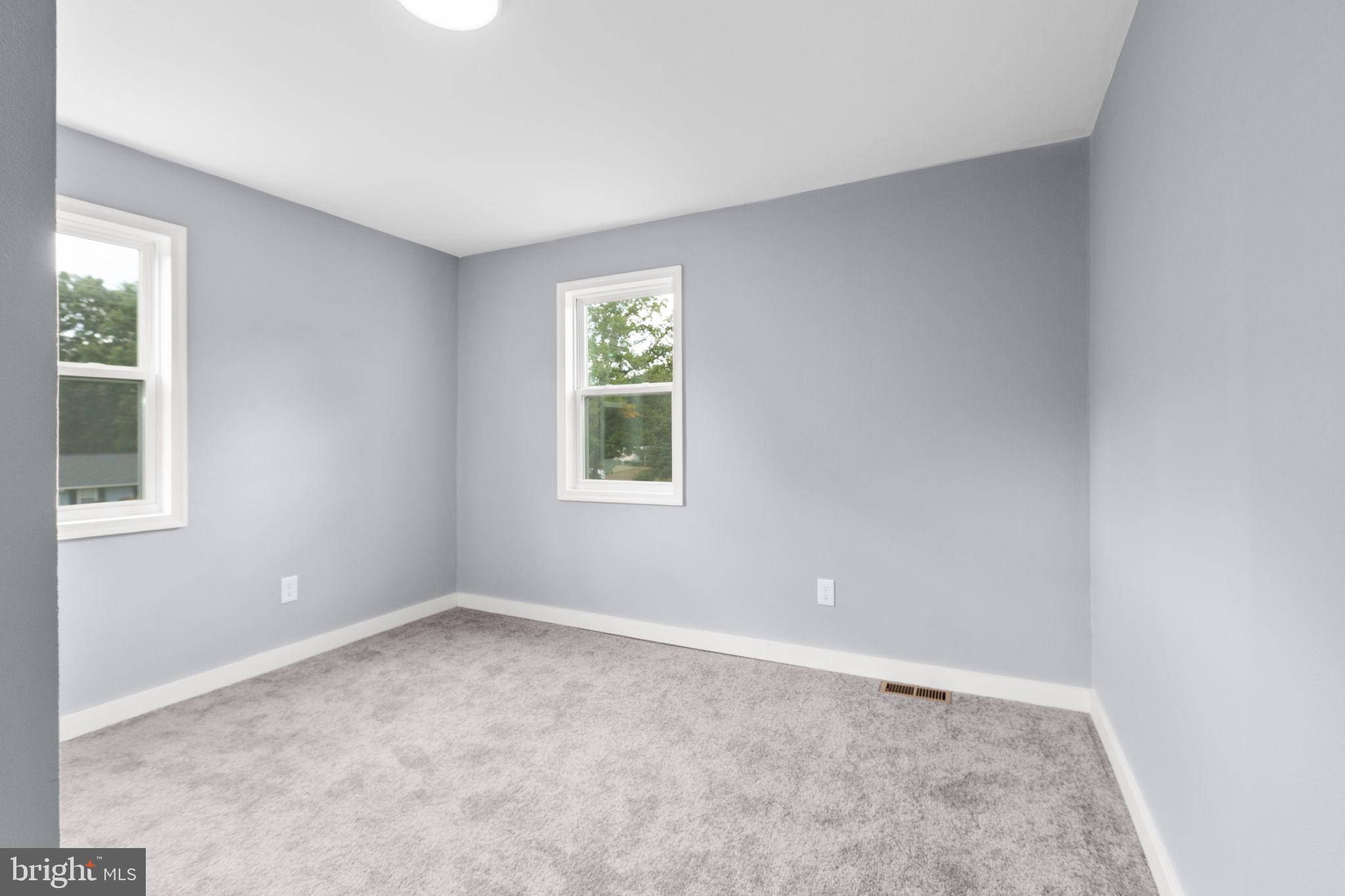 9113 Thornton Rolling Road Fredericksburg, VA 22408 - Photo 26 of 31 an empty room with windows