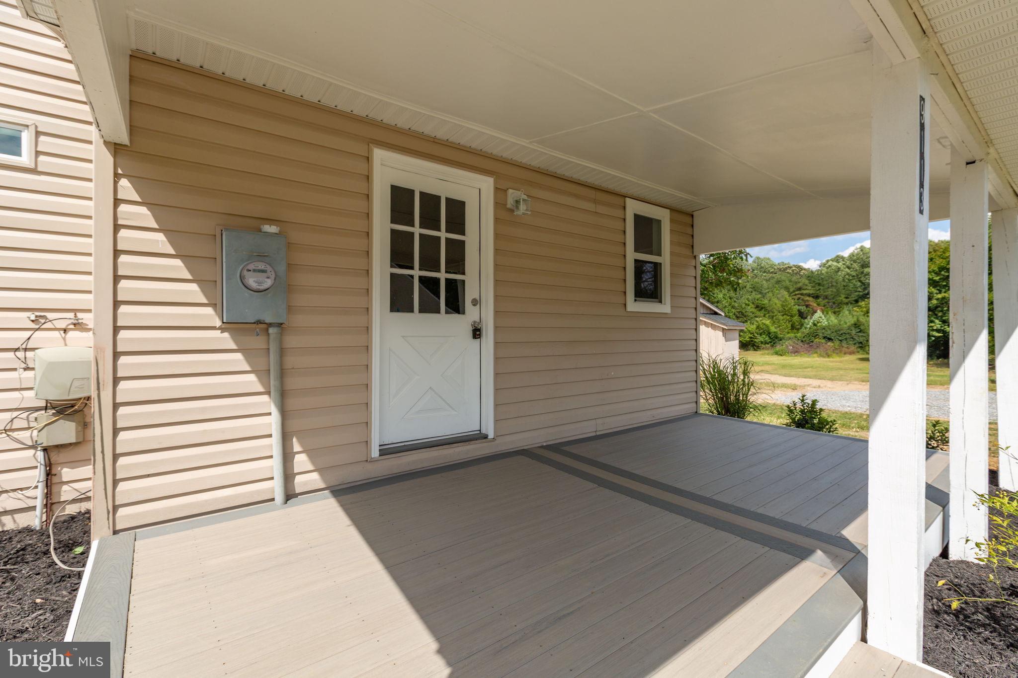 9113 Thornton Rolling Road Fredericksburg, VA 22408 - Photo 27 of 31 a view of a back yard of the house