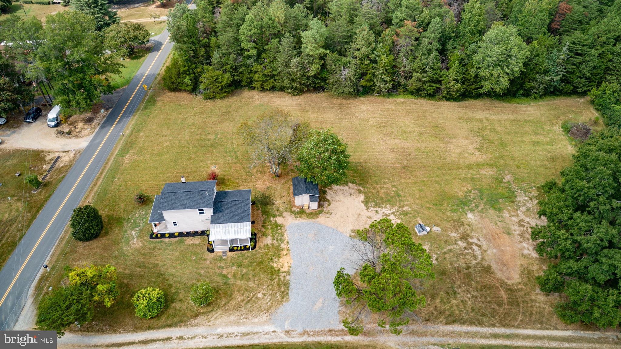 9113 Thornton Rolling Road Fredericksburg, VA 22408 - Photo 30 of 31 an aerial view of a house with a yard basket ball court and outdoor seating