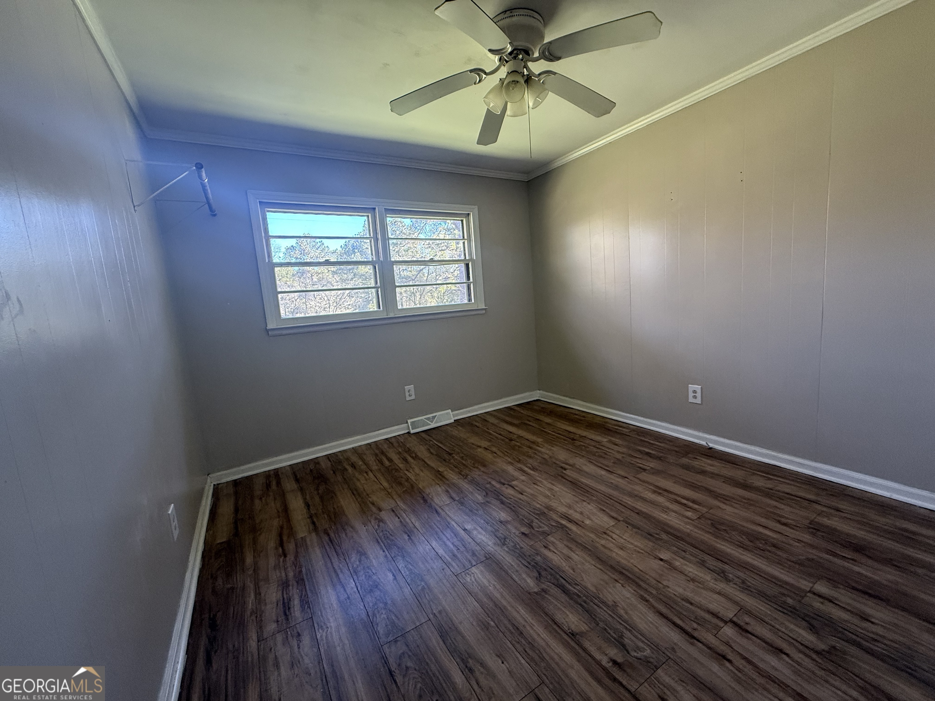 28 Brewer Road Jewell, GA 31045 - Photo 15 of 27 wooden floor in an empty room with a window