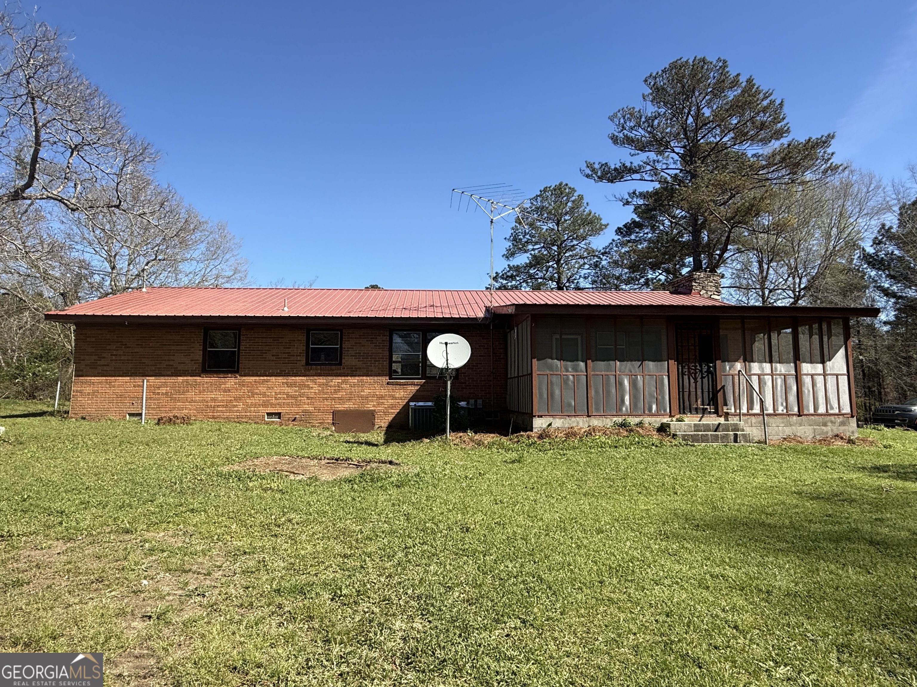 28 Brewer Road Jewell, GA 31045 - Photo 23 of 27 a view of a house with a yard