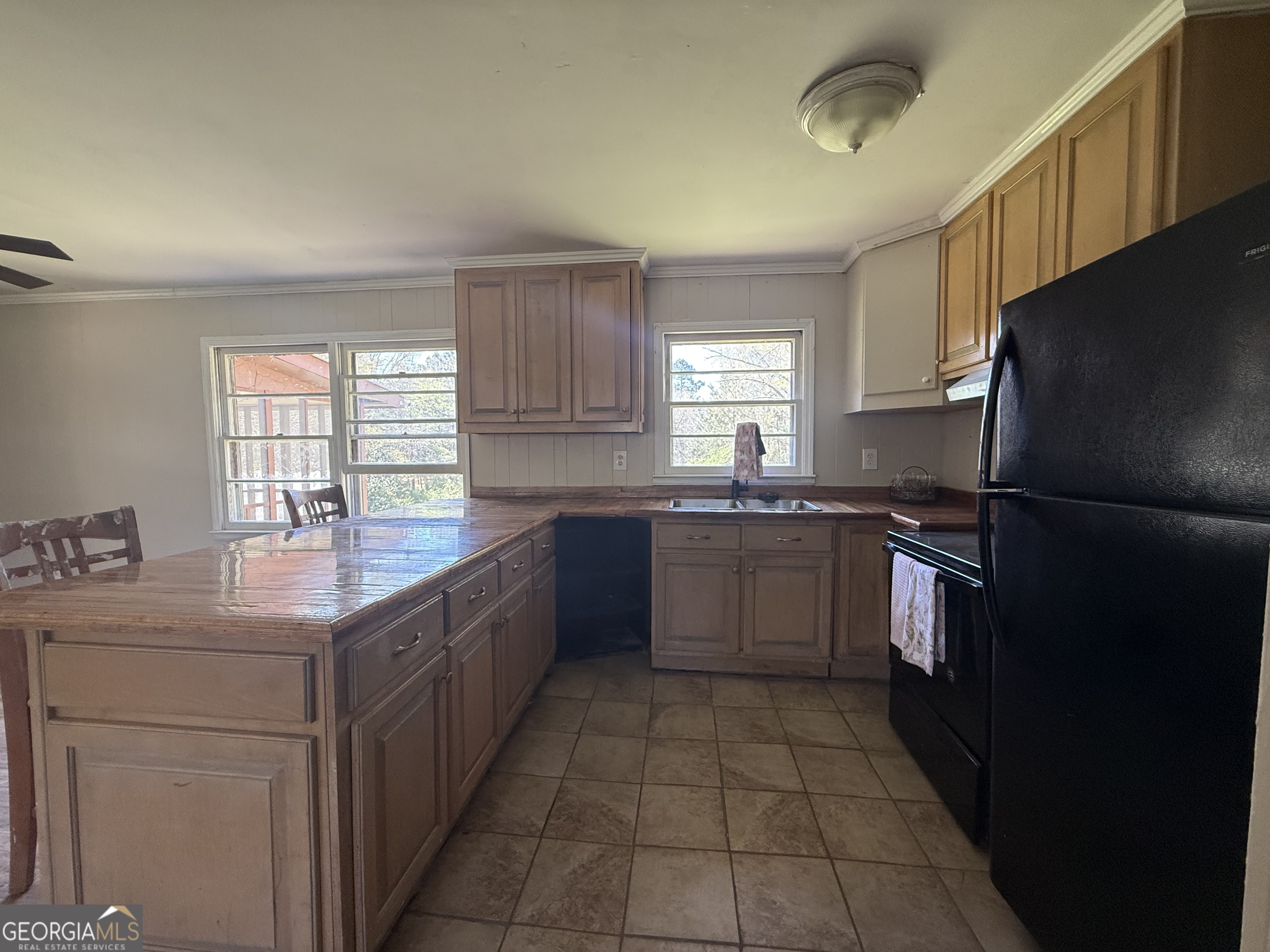 28 Brewer Road Jewell, GA 31045 - Photo 8 of 27 a kitchen with stainless steel appliances granite countertop a sink counter space cabinets a window and a counter space