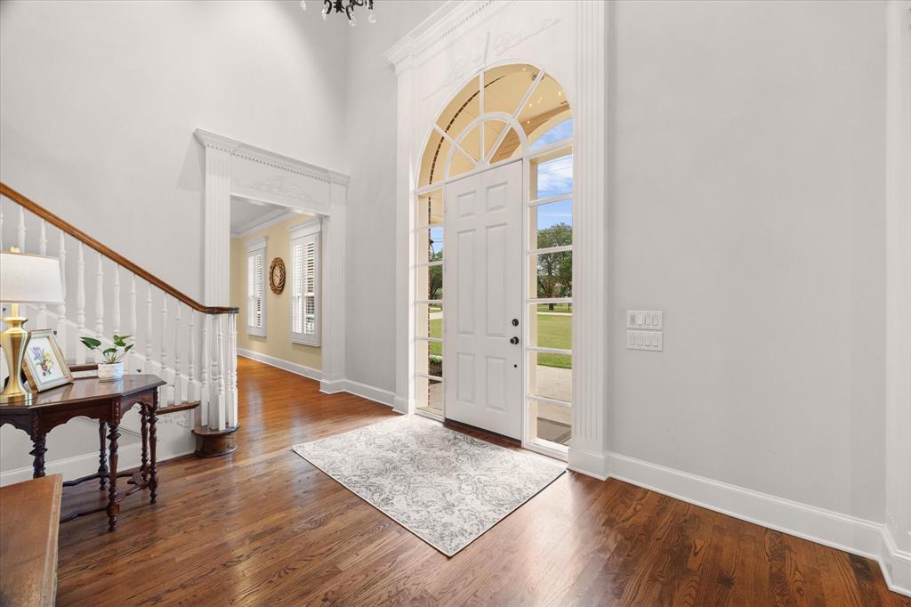 506 Meadowview Road Heath, TX 75032 - Photo 11 of 32 an entryway with wooden floor and windows