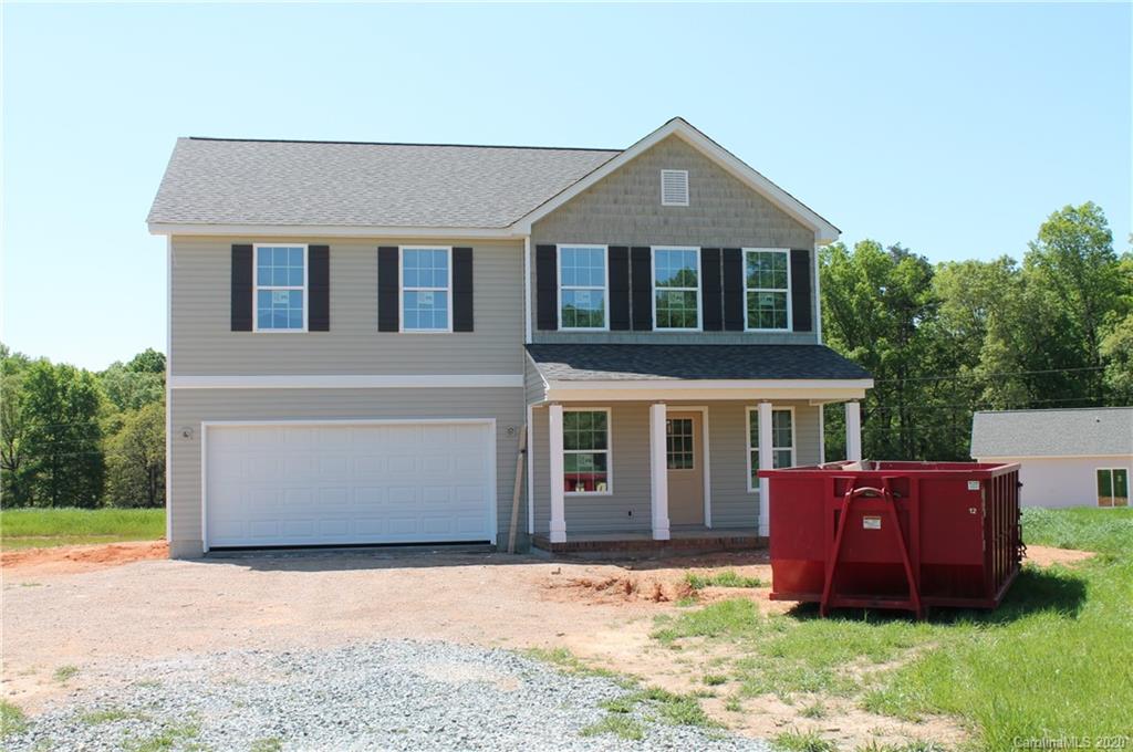 8611 Landsford Road Monroe, NC 28112 - Photo 1 of 3 a front view of a house with a yard