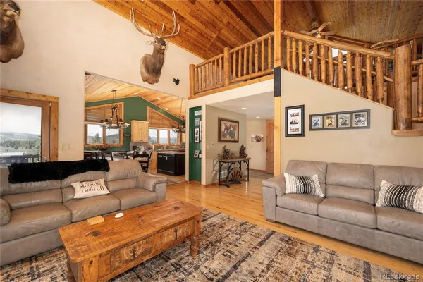 a living room with furniture and a rug