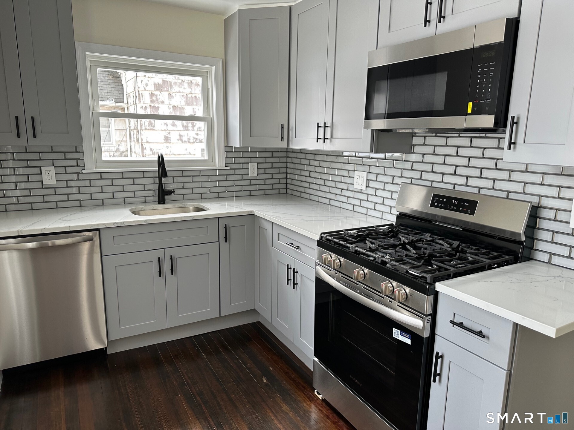 713 South Main Street Torrington, CT 06790 - Photo 3 of 10 a kitchen with cabinets appliances and a sink
