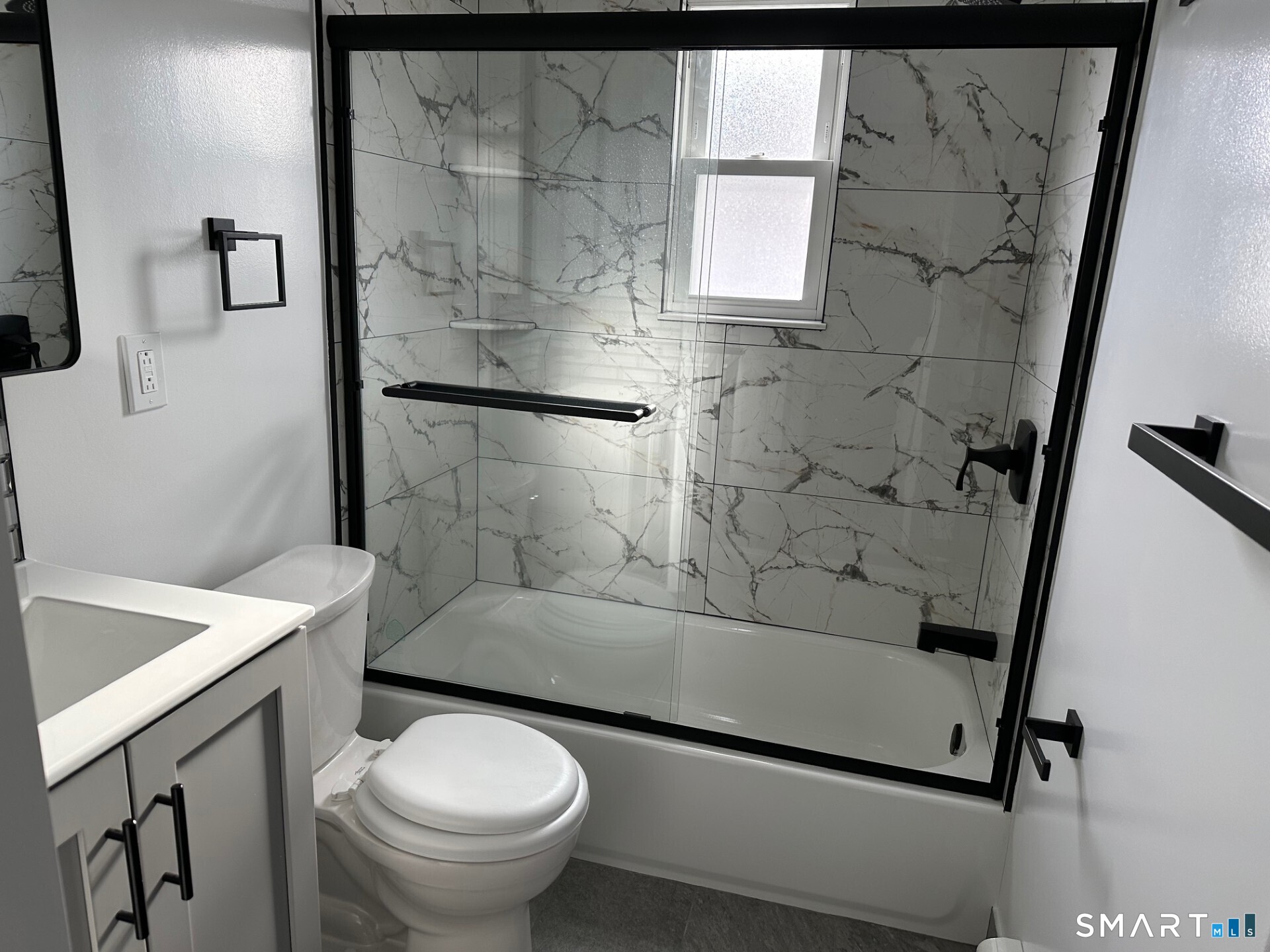 713 South Main Street Torrington, CT 06790 - Photo 5 of 10 a bathroom with a sink toilet and shower