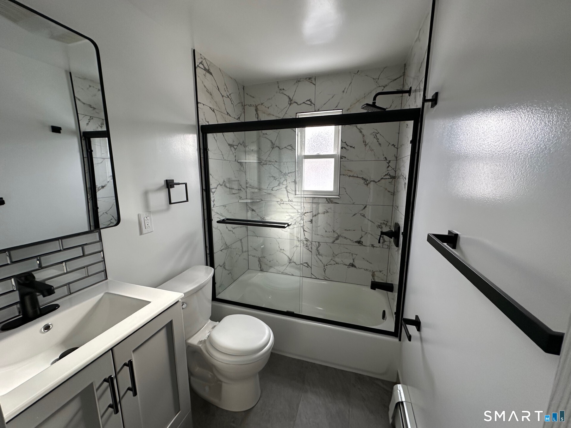 713 South Main Street Torrington, CT 06790 - Photo 6 of 10 a bathroom with a shower toilet and sink