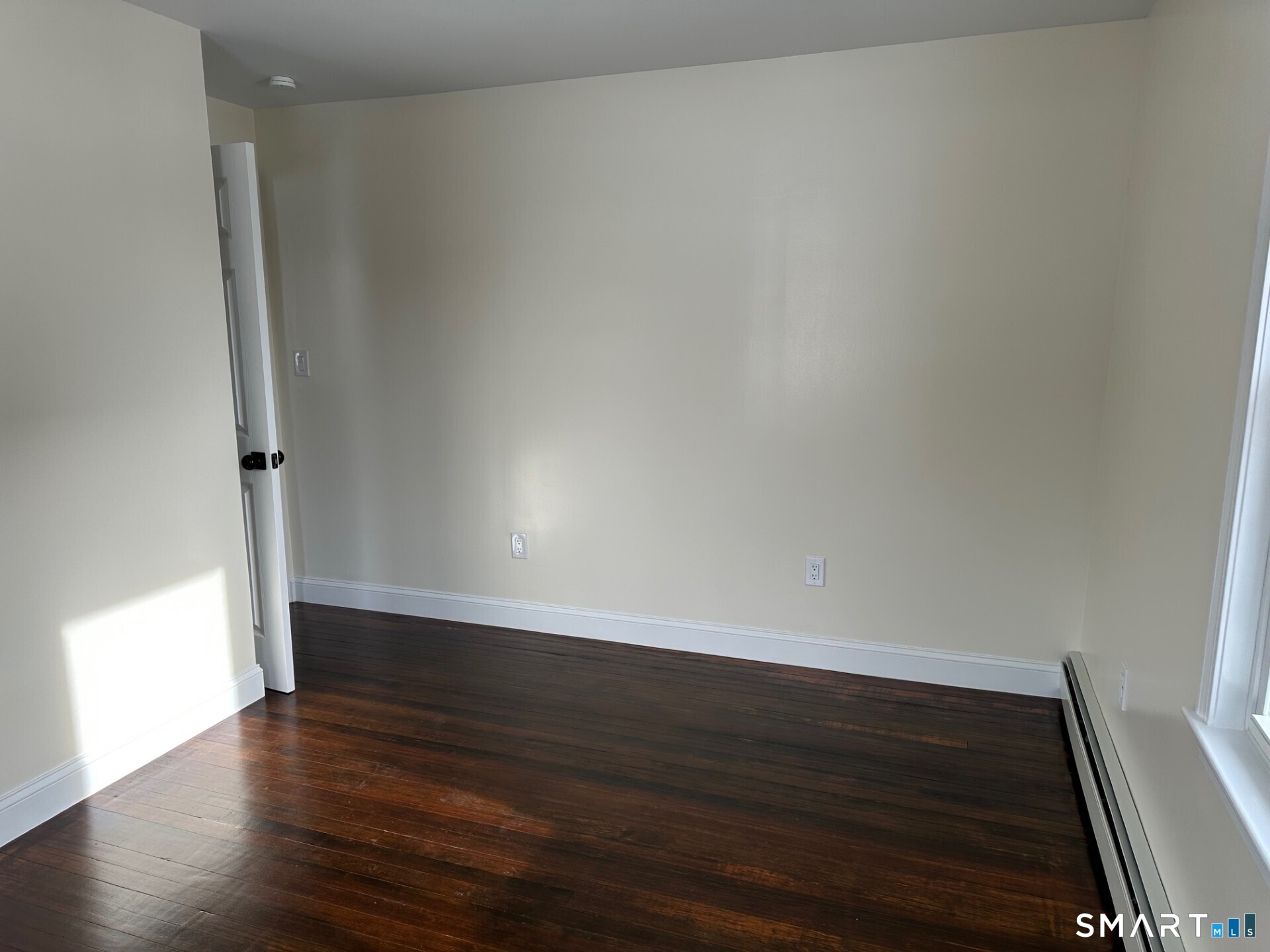 713 South Main Street Torrington, CT 06790 - Photo 7 of 10 a view of an empty room and wooden floor