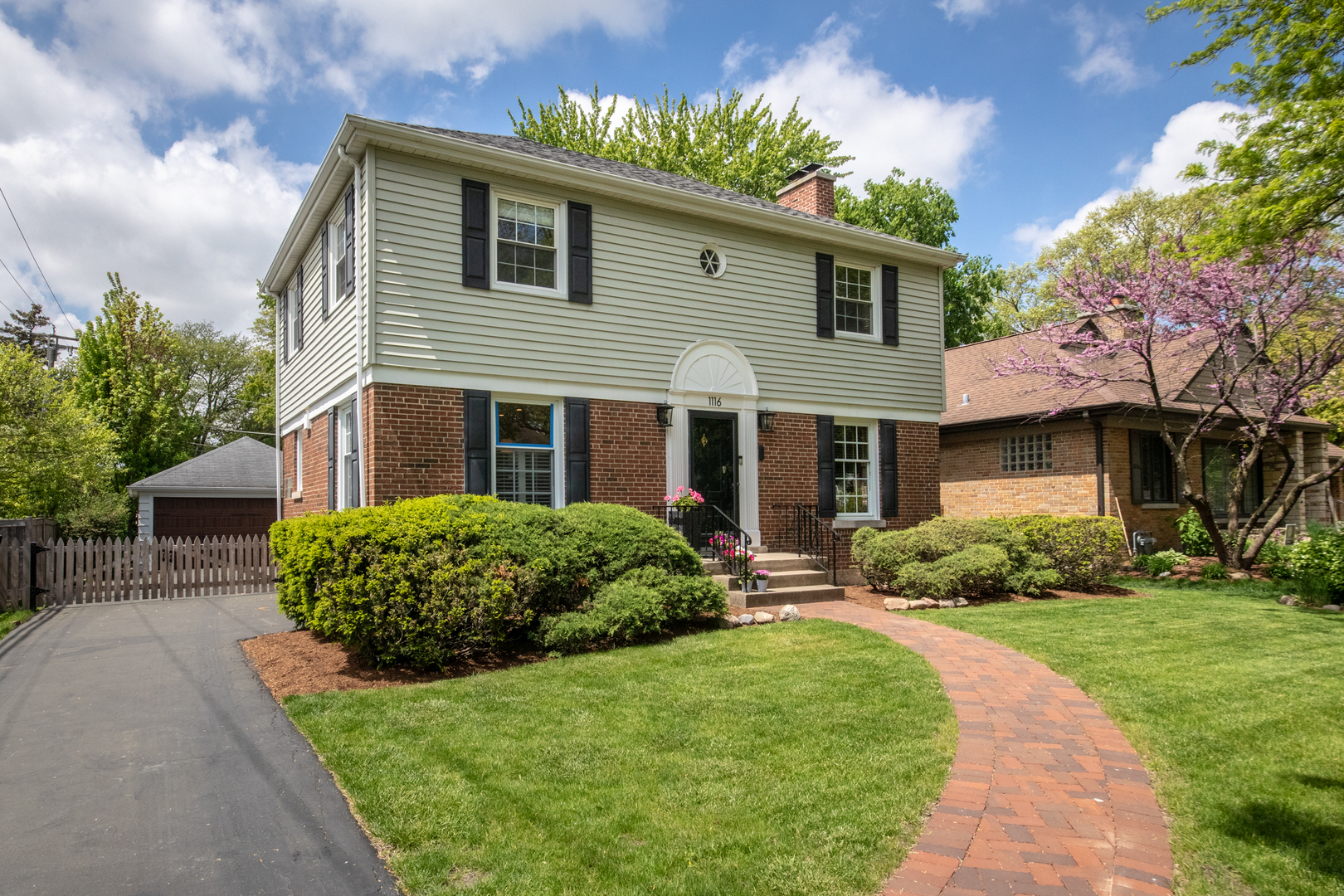 1116 South Aldine Avenue Park Ridge, IL 60068 - Photo 2 of 31 a front view of a house with garden