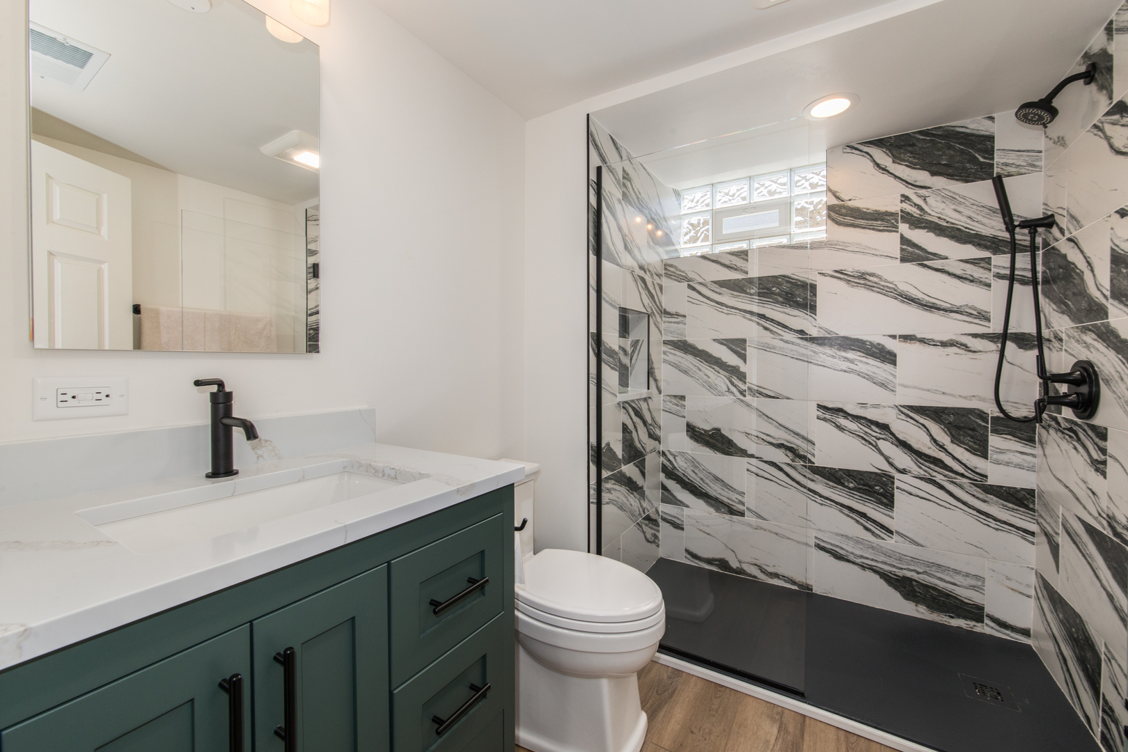 1116 South Aldine Avenue Park Ridge, IL 60068 - Photo 22 of 31 a bathroom with a sink a toilet and shower