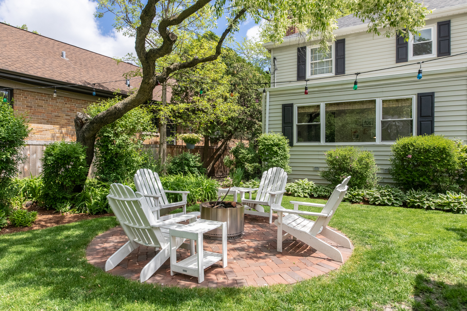 1116 South Aldine Avenue Park Ridge, IL 60068 - Photo 24 of 31 a view of a chair and table in backyard of the house