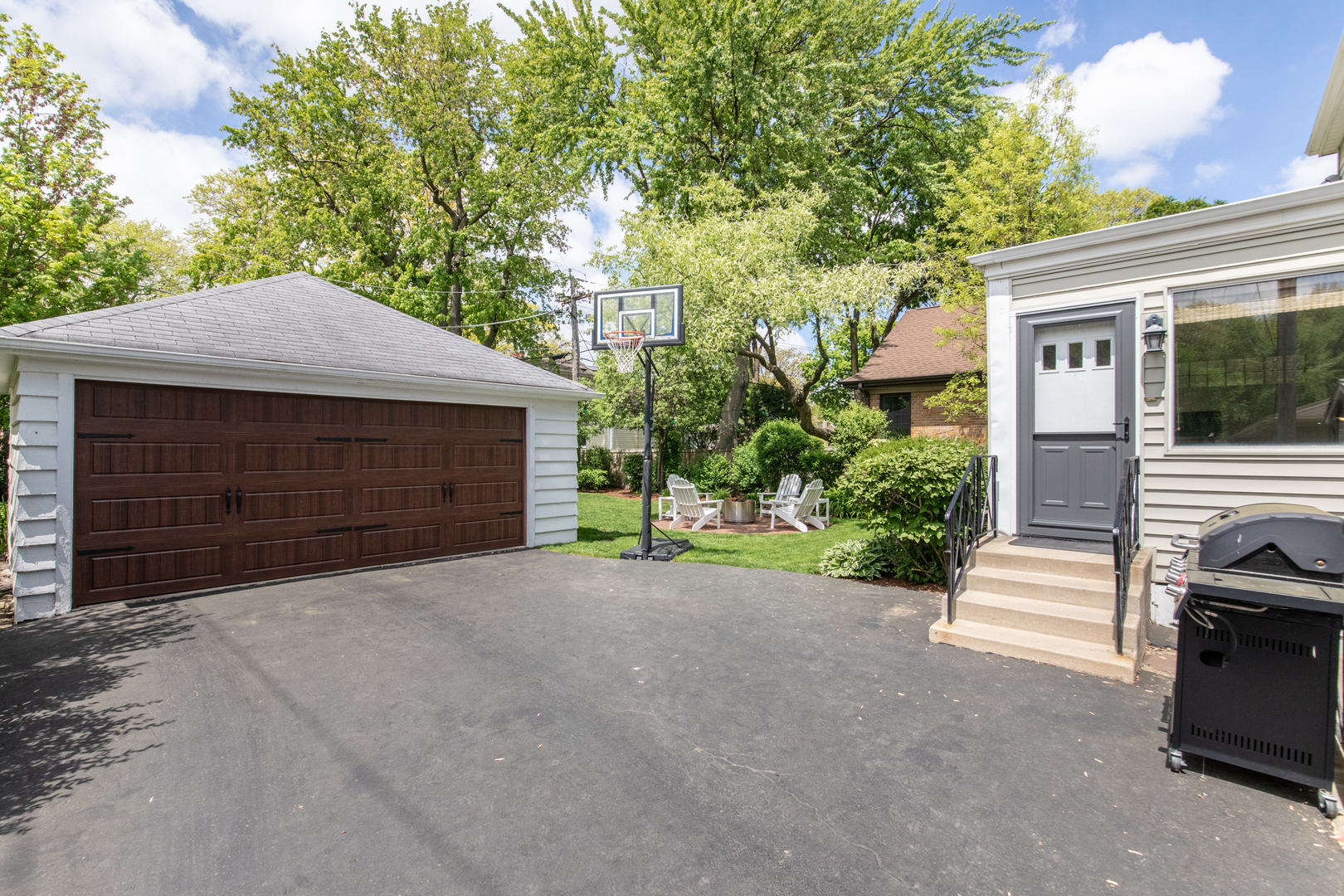 1116 South Aldine Avenue Park Ridge, IL 60068 - Photo 28 of 31 a front view of a house with a yard and garage